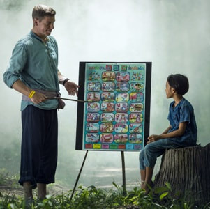 man teaching young boy